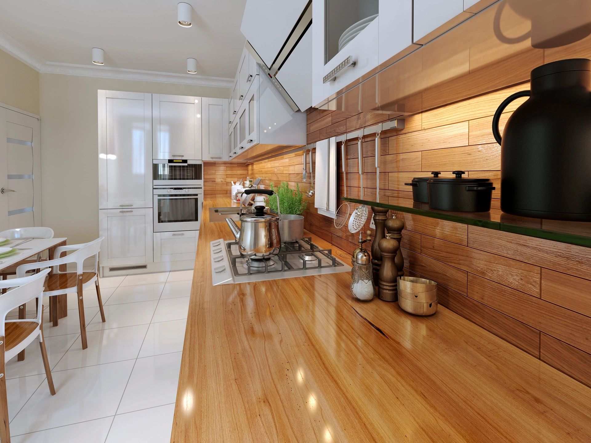 Modern kitchen design featuring sleek cabinetry, polished wooden countertops, stainless steel appliances, and stylish decor elements, reflecting luxury and craftsmanship in custom home building by Pride Construction & Roofing.